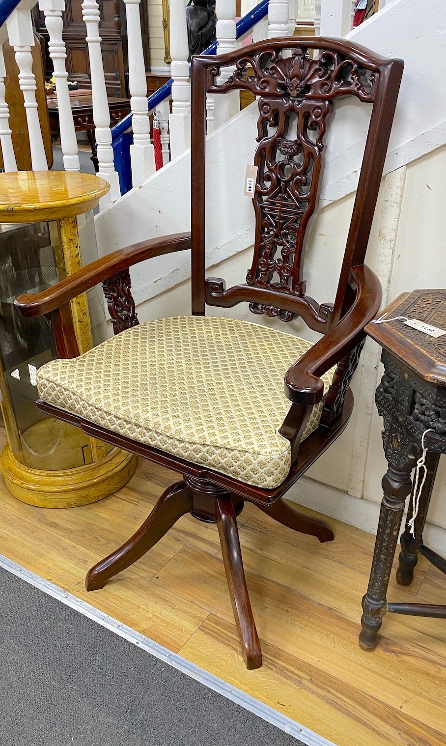 A large Chinese hardwood swivel desk chair, width 73cm